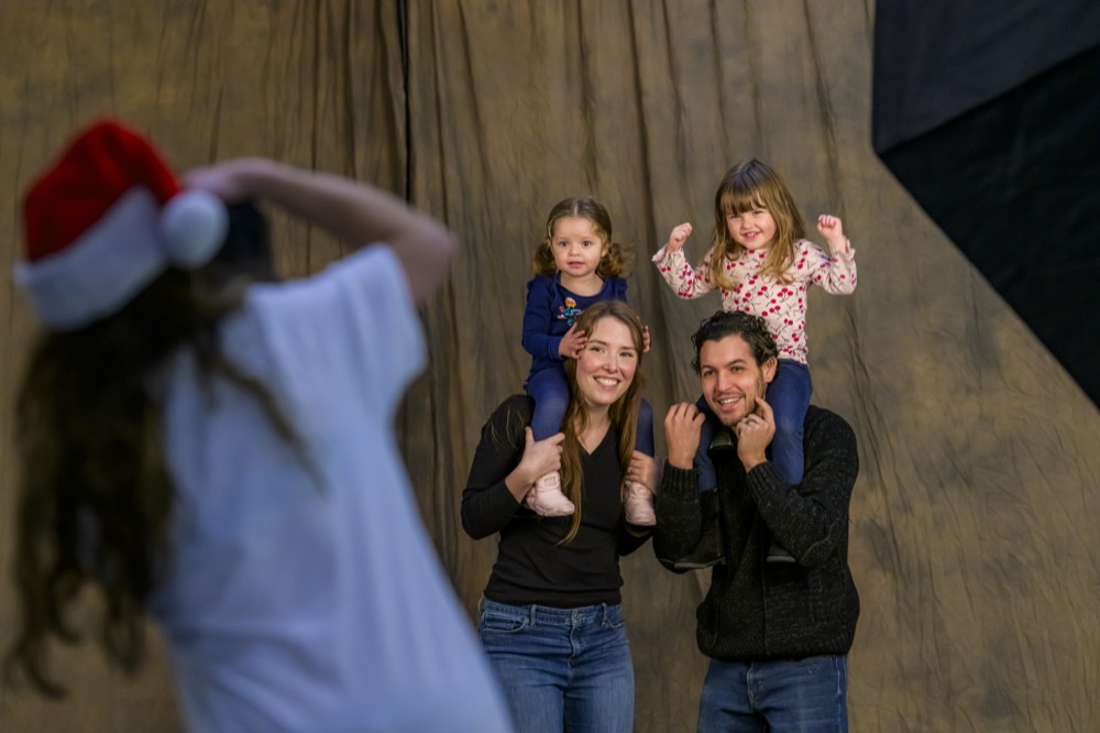 People in the studio during the 2024 help portrait event