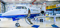 Aviation Technology Jet sits in the Mason Jewett Airport hanger with its door open