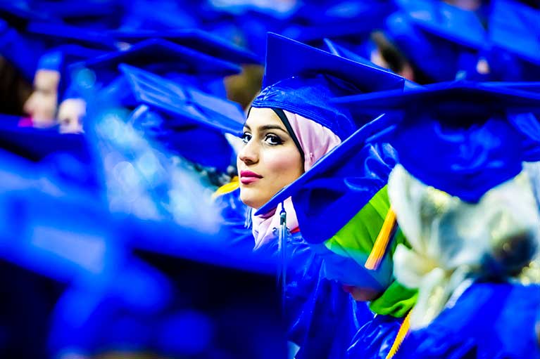 an lcc student wearing her hijab and graduation cap at commencement