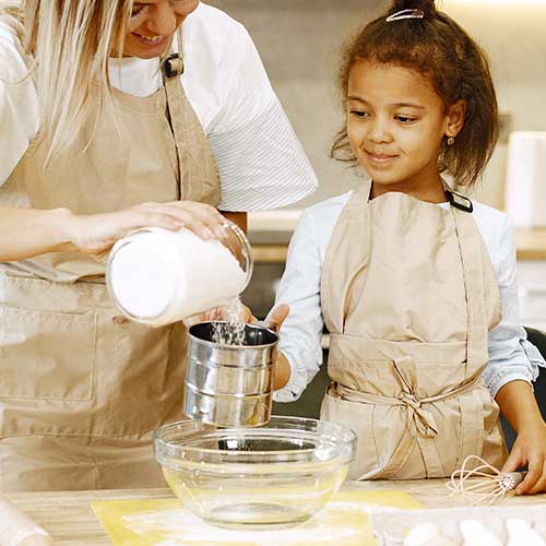 Child mixing baking ingredients