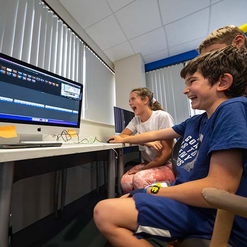 Students editing computer video