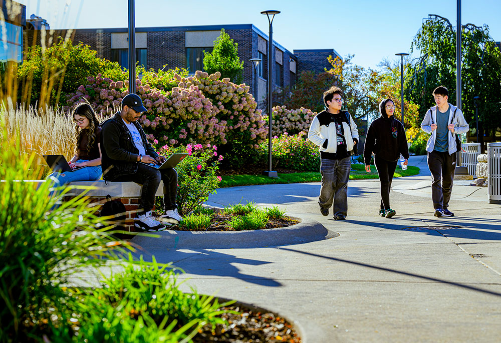 students outside walking through campus