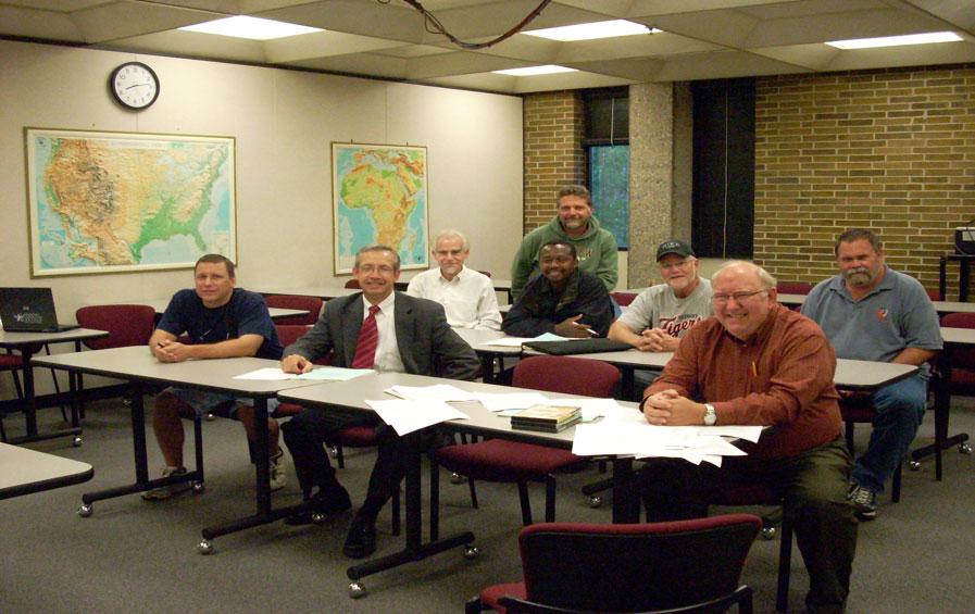 richard nelson with other instructors and students in an economics classroom august 2007