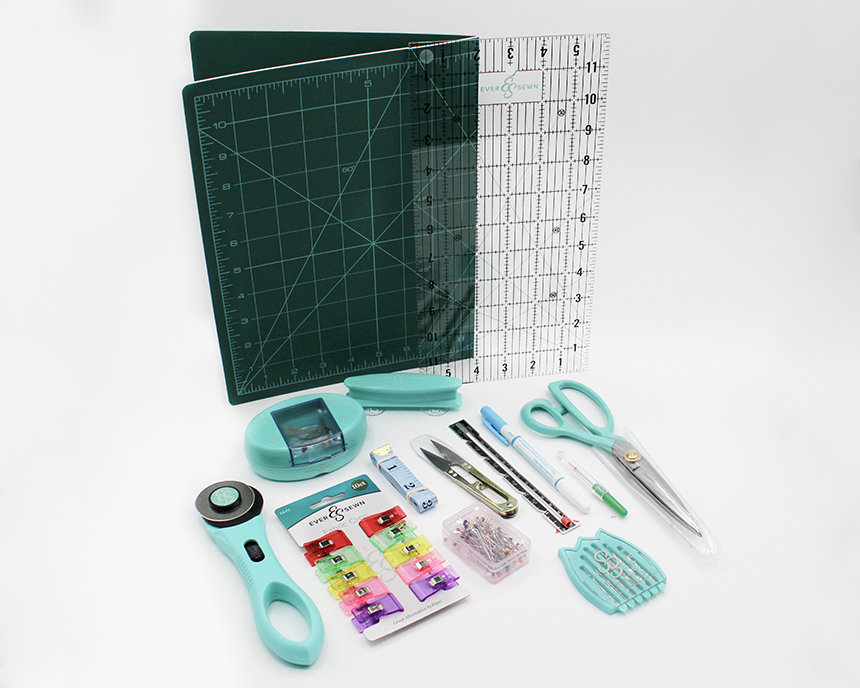 Sewing needles, thread, scissors, measuring tables