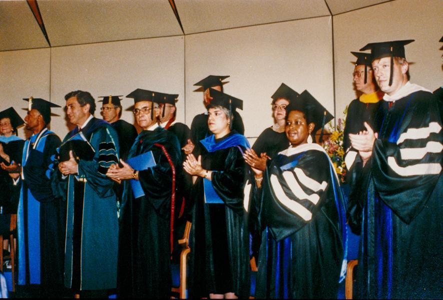 LCC Trustees and administrators along with the MSU President stand in academic regalia at LCC's graduation.