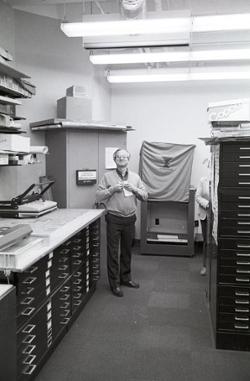 Paul Engstrom, Director of Physical Plant, stands in the Blueprint Room in AOF.