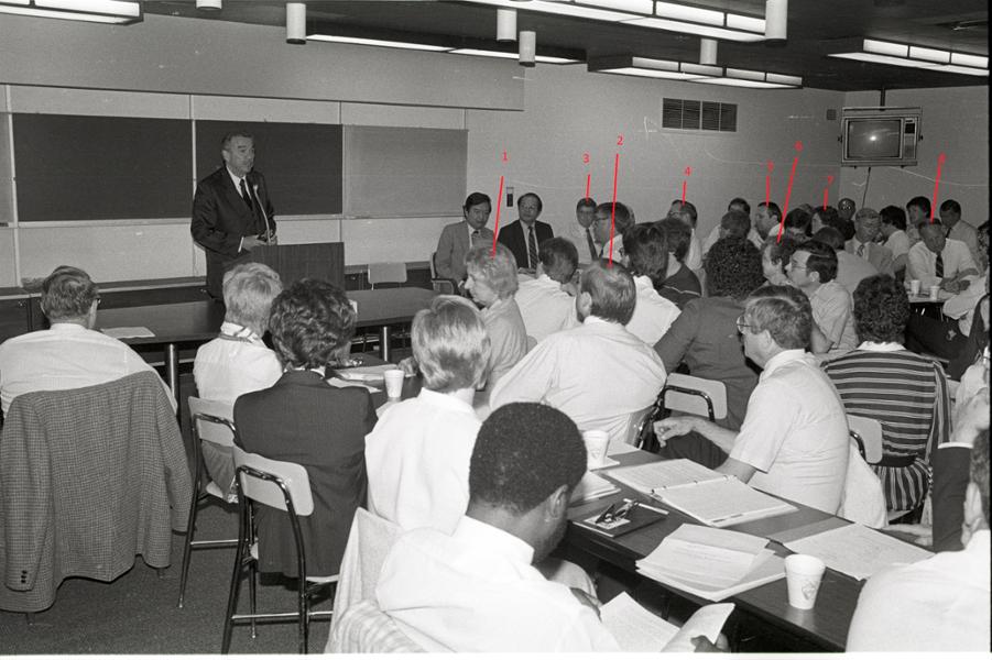 President Gannon speaks to event attendees in a classroom.