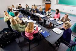 The members of the Support Staff Day Committee meet around a large table.