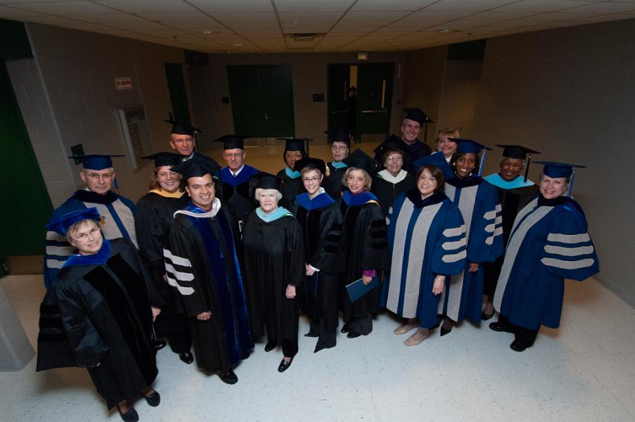 President Judith Cardenas, Board of Trustees members, college staff and administrators, and specials guests pose together before the start of LCC’s 2006 graduation ceremony.