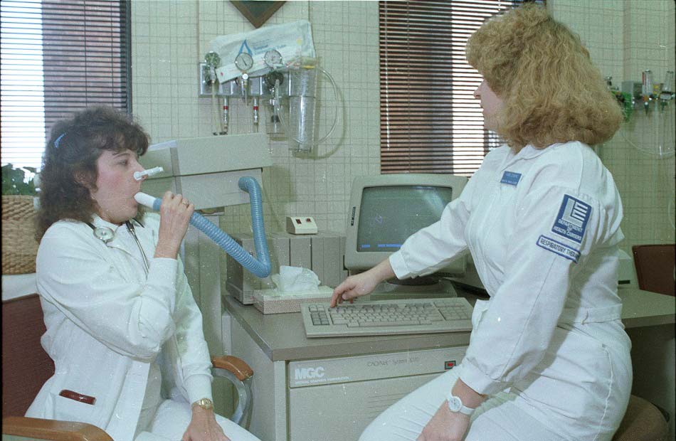 A Respiratory Therapy student from the LCC Department of Health Careers practices using equipment with another student. - ca. 1988