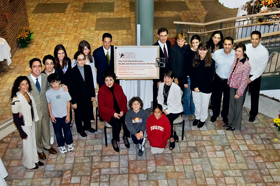 Members of the Abood family gather by the Fred Abood Rotunda plaque at the Health and Human Services Building rotunda dedication event - December 2005