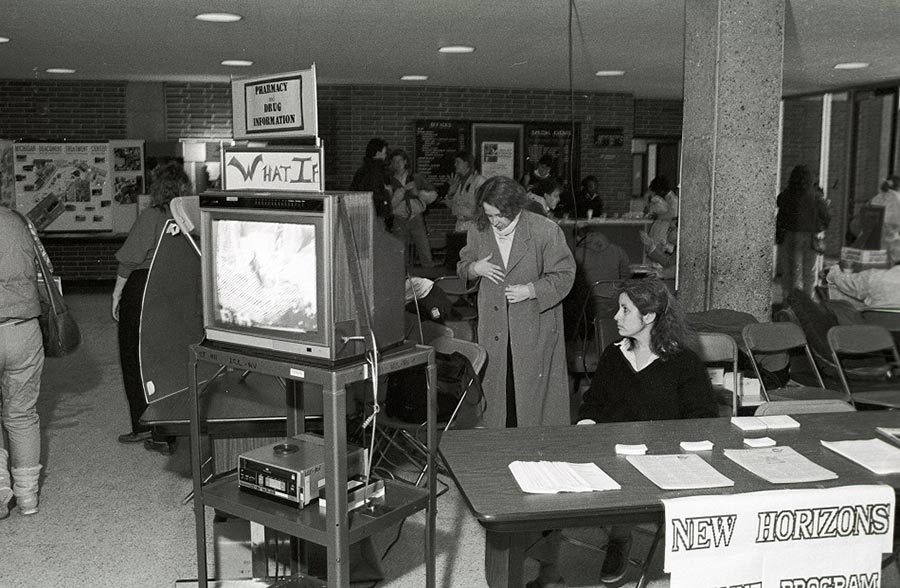 Classic AV equipment being used at a Campus Community Organizations event in the Arts and Sciences Building - 1988