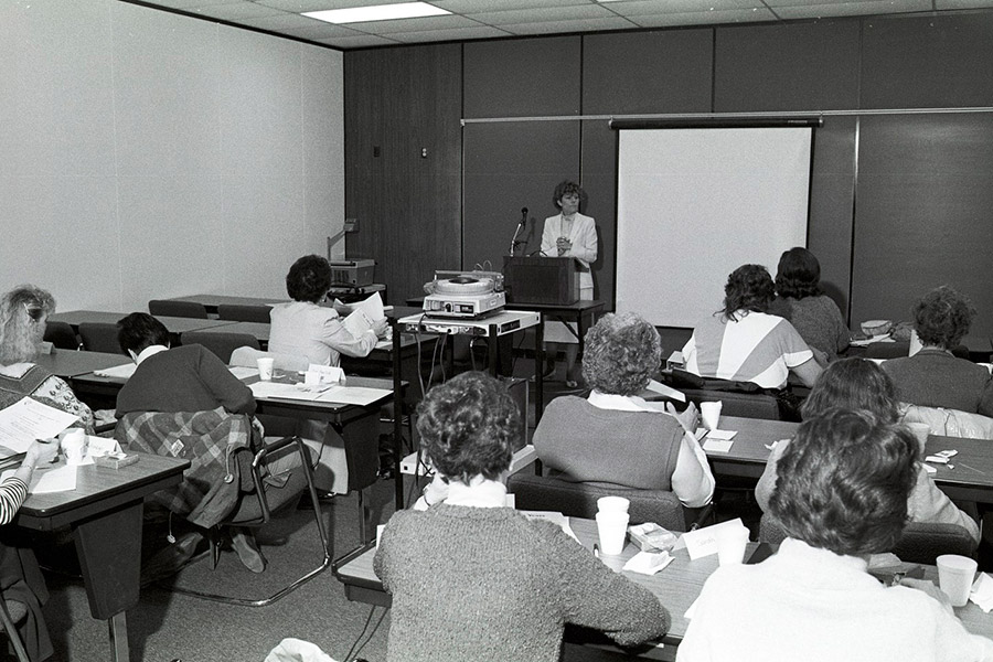 An Instructor is ready to present in a classroom - ca. 1980s