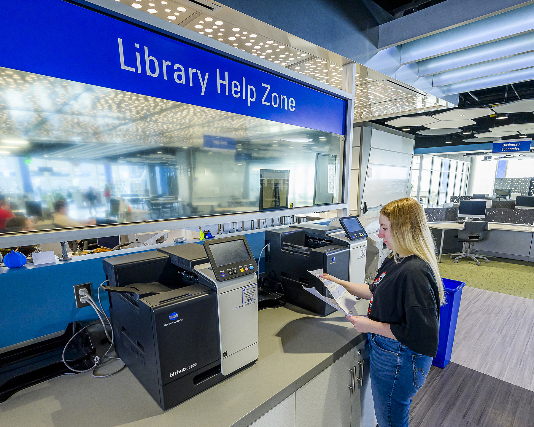 a student retrieves a print from the printer