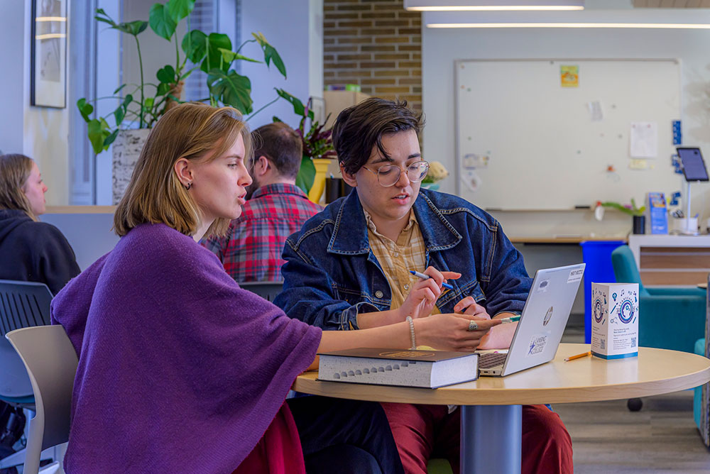 Student receiving writing center support